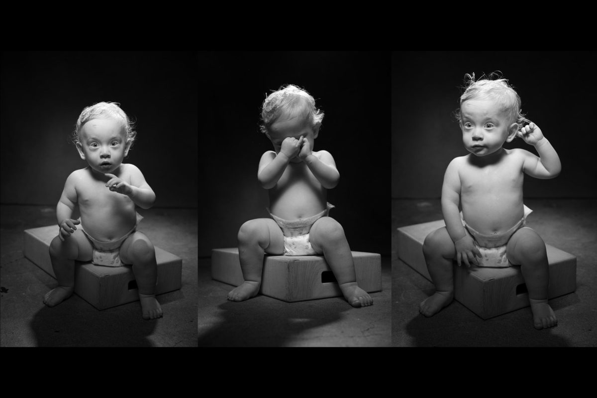 3 black and white children's portraits of a toddler boy sitting on an apple box