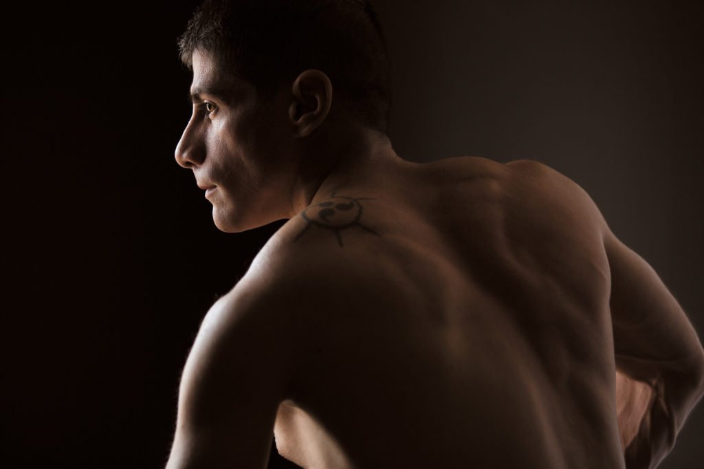 high contrast profile portrait by fitness photographer Jason Guy