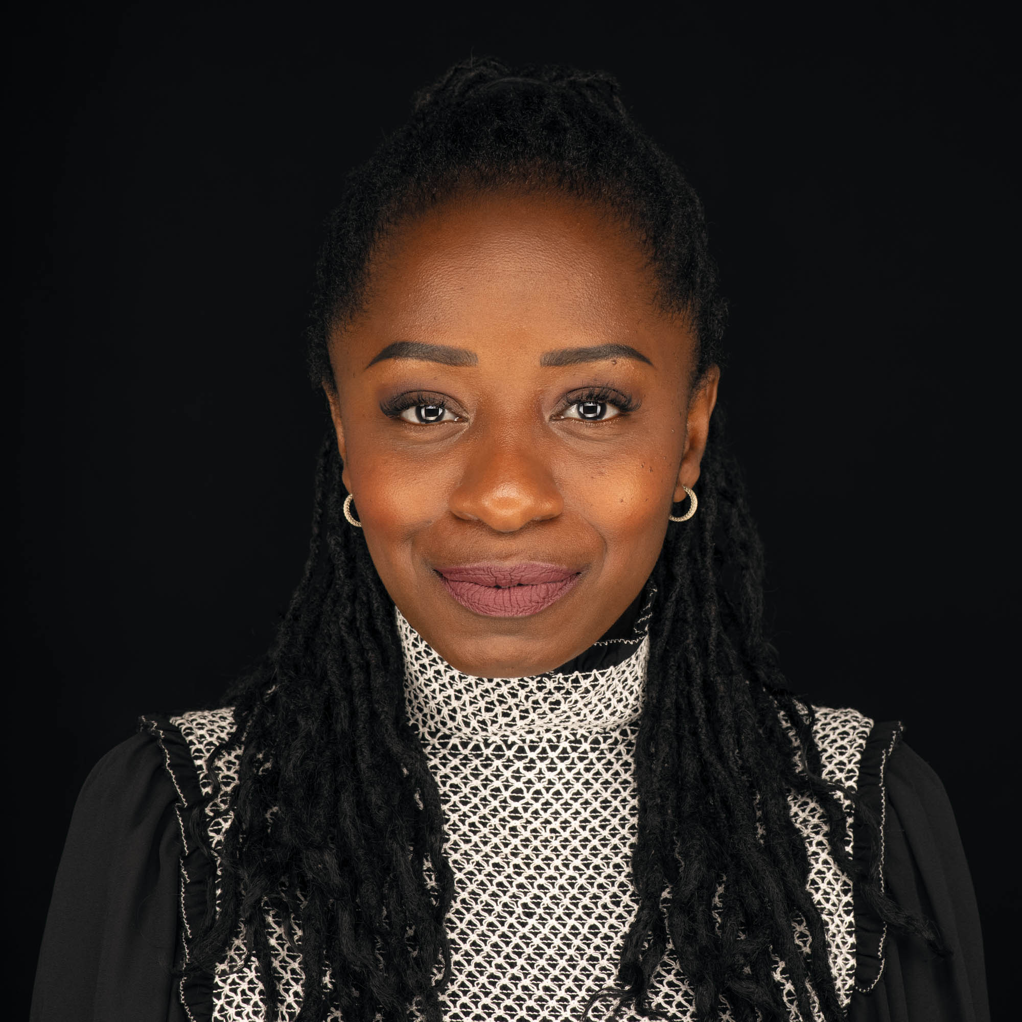 portrait of a black woman on a black background